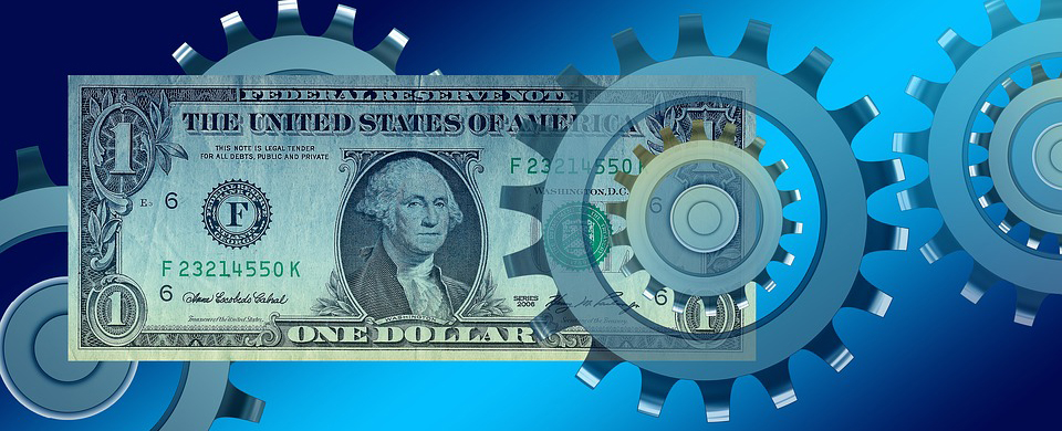 dollar bill moving through metal gears